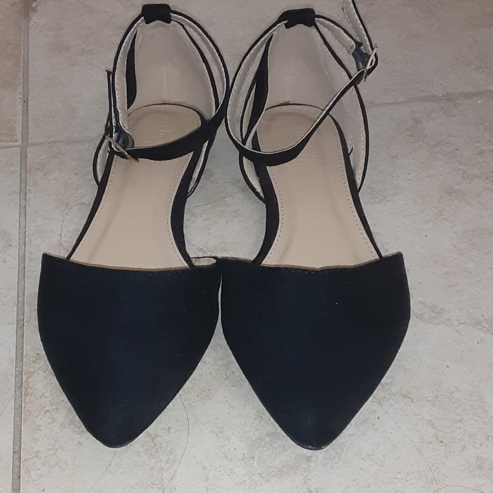 Black pointed flats with an ankle strap